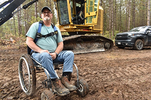 Steve Mihalko sits in front of his harvester.