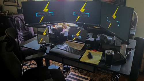 Equipment funded by DVR to accommodate Eddie's new role with Trusted Electric included an ergonomic chair, motorized desk, monitors, keyboard, tablet, and other assistive technology.