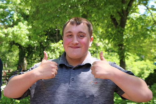 Tanner Heubner gives a double thumbs up for the camera celebrating his graduation from the Milwaukee County Zoo Project SEARCH program on Friday, June 3.