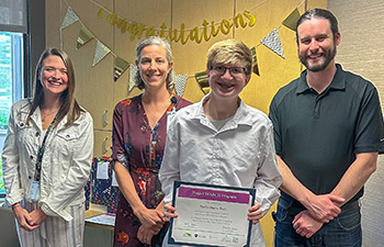 Project SEARCH intern Hailey Hagen-Bade (center-right), with (left to right) Natasha Herum, Project SEARCH Instructor, Emily LaBadie, Project SEARCH Skills Trainer, and Ben Wilen, Project SEARCH Skills Trainer. 