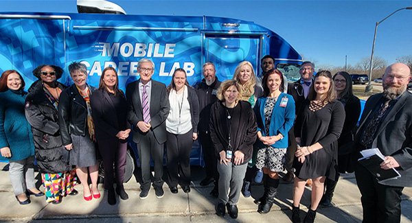 Gov. Evers joins DWD and DHS representatives for a visit to the Central Wisconsin Center and tour of the new mini mobile career lab on Feb. 29, 2024.