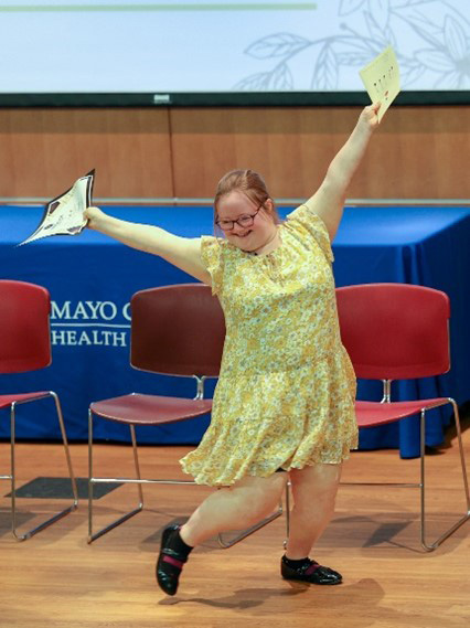 With her graduation certificate in hand, Thea Lenhart danced off the stage to join her family and fellow graduates for cookies and lemonade after the graduation.