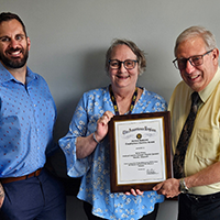 Supervisor Dave Walters, DVOP Nancy Brown, and Director Gary Meyer.  American Legion DVOP of the Year award.