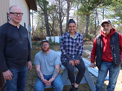 Construction class at Lac Courte Oreilles Ojibwe College. Pictured above: Tom P., Jon B., and De'Ja W. and Instructor Bob B.